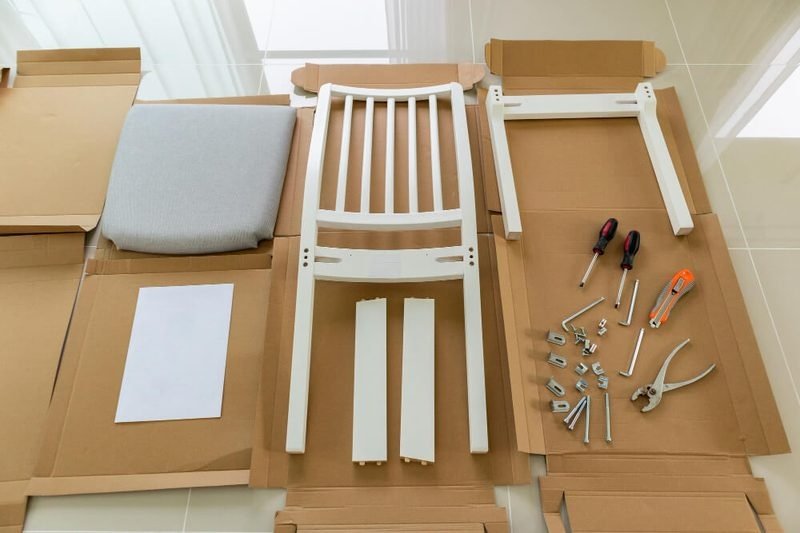 Flat pack assembly Singapore — disassembled chair parts with allen key and screws, furniture assembly service